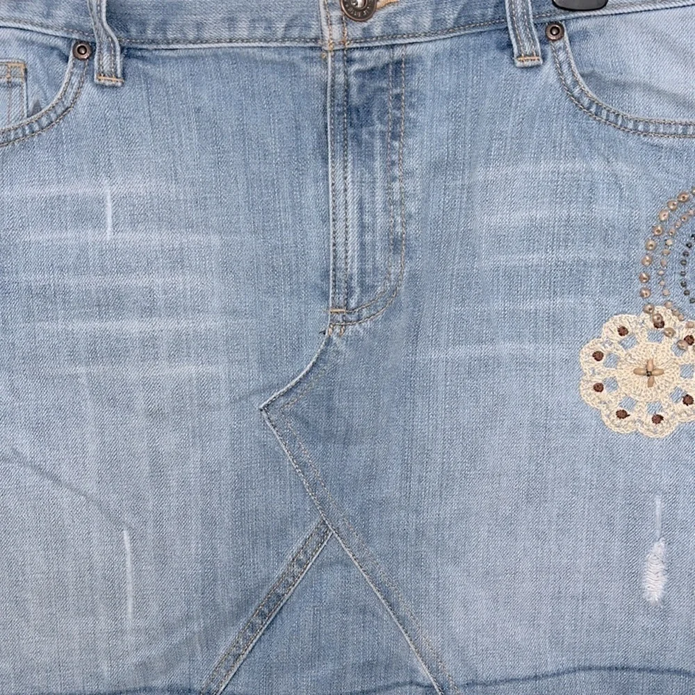 Old Navy’s Jeans ultra low waist stonewashed boho distressed frayed mini skirt.